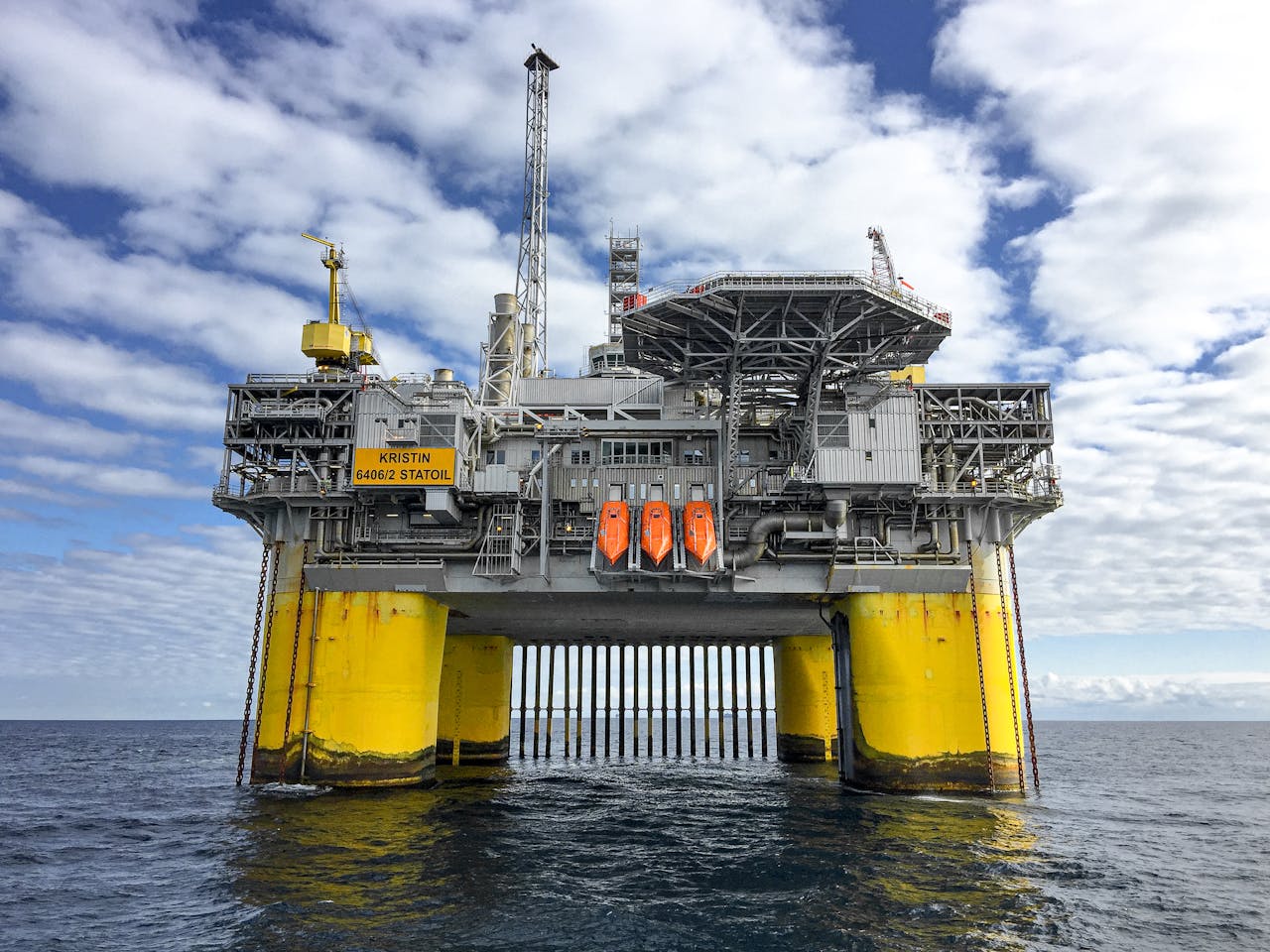 services-03 Majestic offshore oil platform in Norway's North Sea, under blue skies.